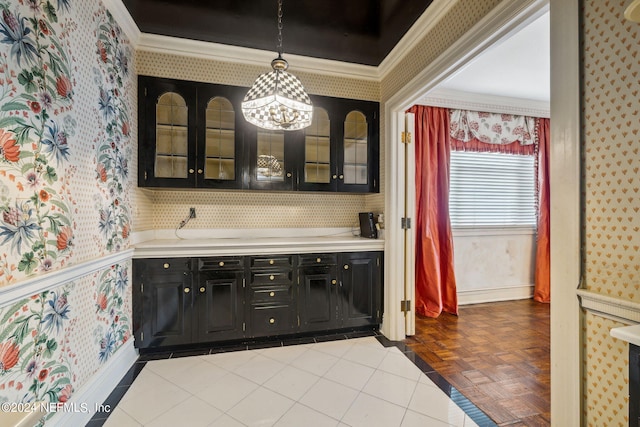 interior space featuring ornamental molding, decorative light fixtures, and parquet flooring