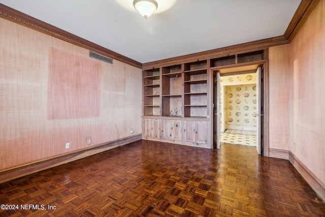 interior space with ornamental molding and dark parquet flooring