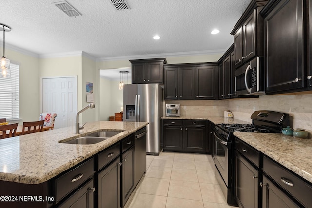 kitchen featuring crown molding, sink, an island with sink, appliances with stainless steel finishes, and decorative light fixtures