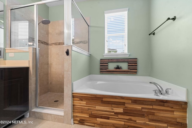 bathroom featuring tile patterned flooring, vanity, and independent shower and bath