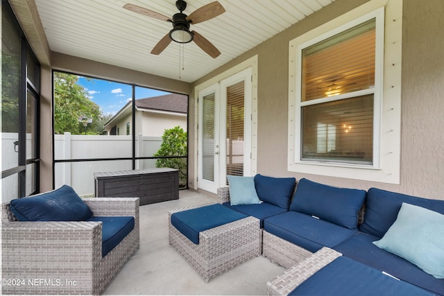 sunroom / solarium featuring ceiling fan