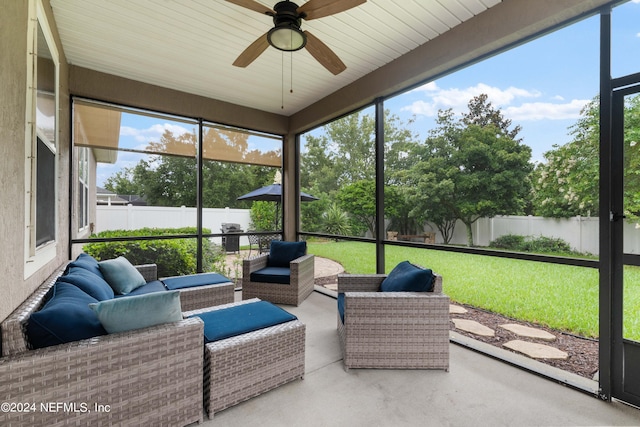 sunroom with ceiling fan and a healthy amount of sunlight