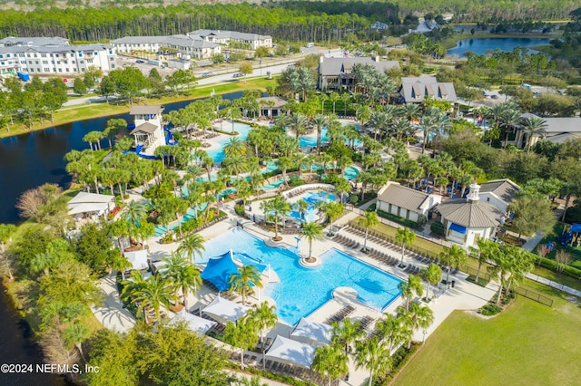 birds eye view of property with a water view