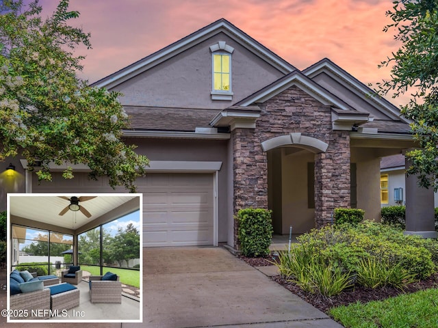 view of front of property with an outdoor living space, a garage, and ceiling fan