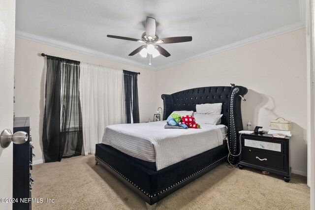 carpeted bedroom with crown molding and ceiling fan