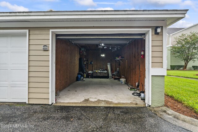 garage featuring wooden walls