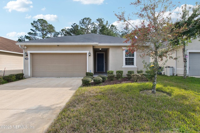 ranch-style house with a garage and a front yard