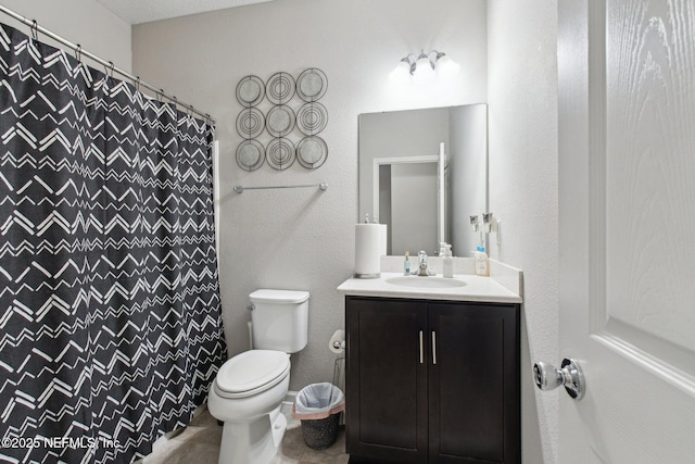 bathroom with vanity, toilet, and a shower with shower curtain