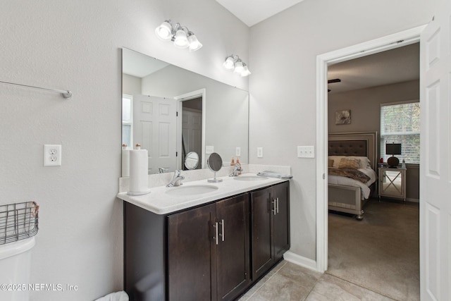 bathroom with tile patterned flooring and vanity