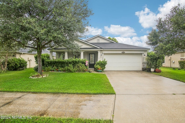 single story home with a front yard and a garage