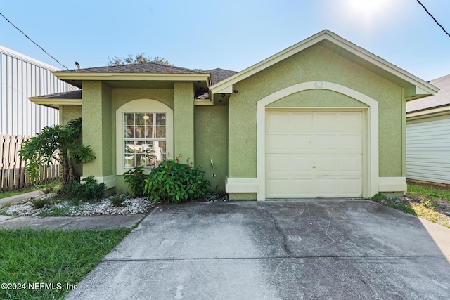 single story home featuring a garage