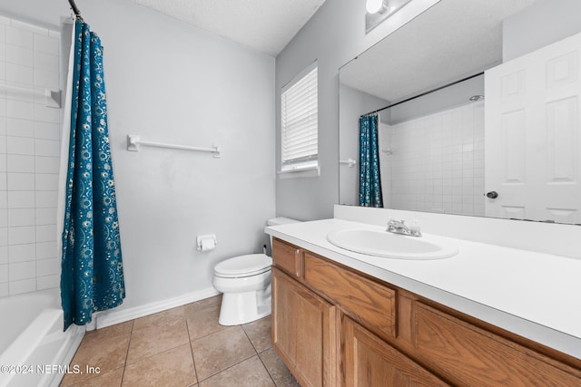 full bathroom with shower / bath combination with curtain, tile patterned flooring, vanity, toilet, and a textured ceiling