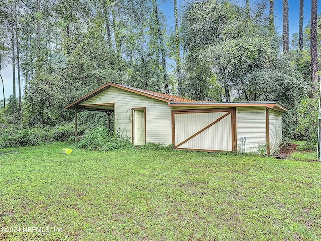 view of outbuilding with a lawn