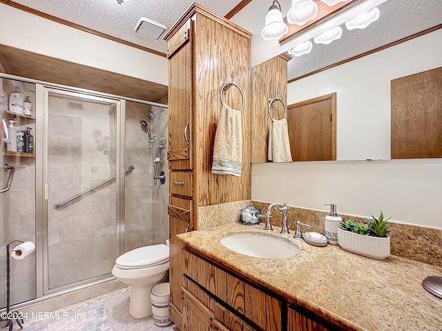 bathroom featuring crown molding, vanity, a shower with shower door, and a textured ceiling