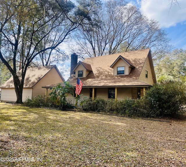 35061 Karen Rd, Callahan, FL 32011 - view of front of house with a chimney, a front lawn, and roof with shingles