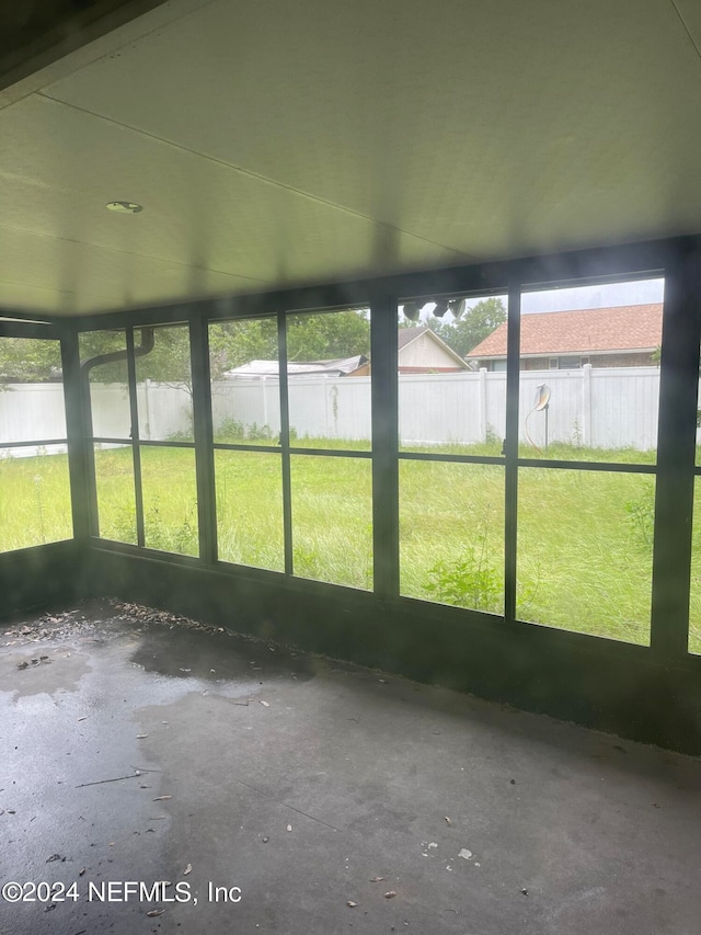 unfurnished sunroom with a wealth of natural light