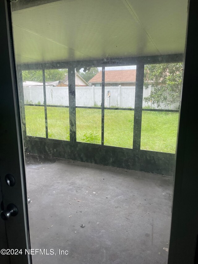 unfurnished sunroom with plenty of natural light