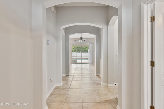 hallway featuring light tile patterned floors