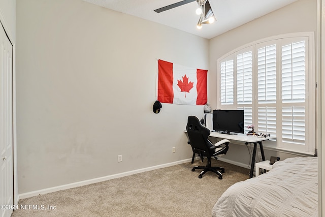 office space with ceiling fan and light colored carpet