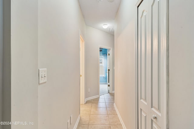 hallway with light tile patterned flooring