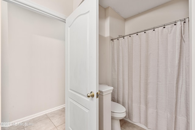 bathroom featuring tile patterned floors and toilet