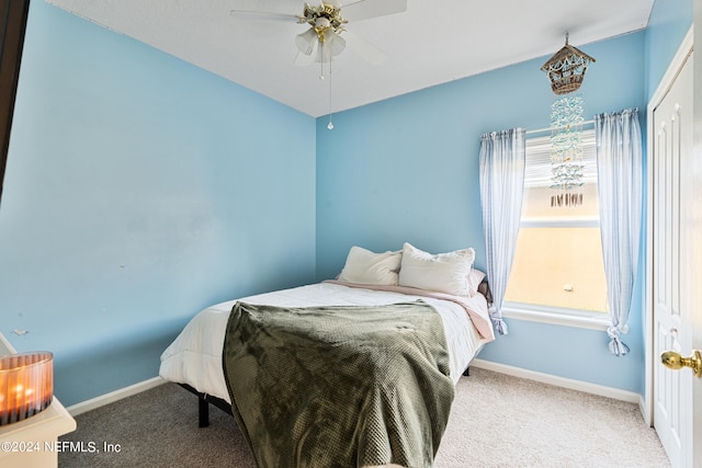 carpeted bedroom featuring ceiling fan