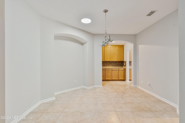 empty room with light tile patterned floors