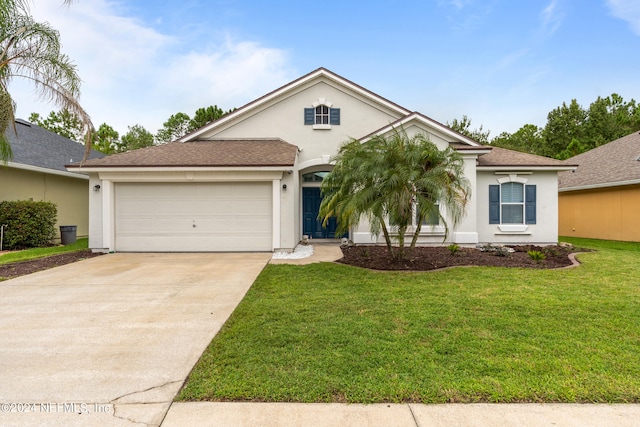 view of front of property featuring a front lawn and a garage