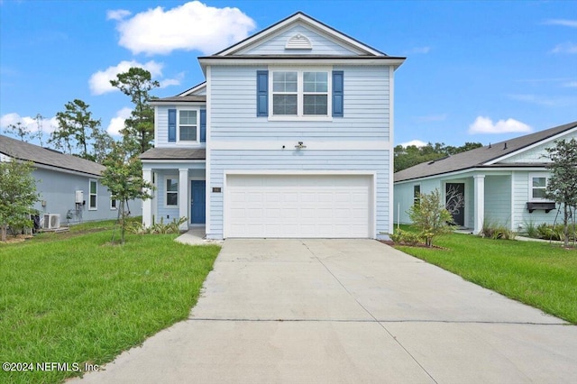 view of front property with a front lawn, central AC unit, and a garage