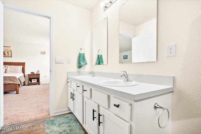 bathroom featuring vanity and hardwood / wood-style flooring