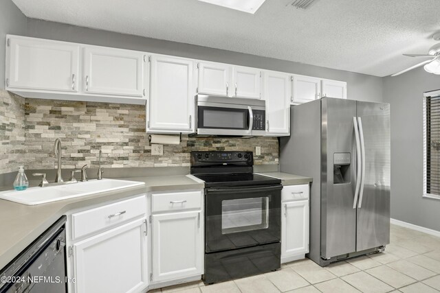 kitchen featuring ceiling fan, white cabinets, and black appliances