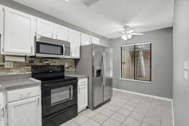 kitchen featuring white cabinets, ceiling fan, appliances with stainless steel finishes, and tasteful backsplash