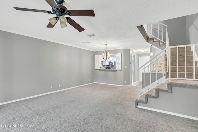 interior space with ceiling fan with notable chandelier, a textured ceiling, carpet flooring, and crown molding