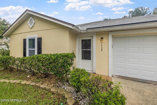 view of front of home with a garage