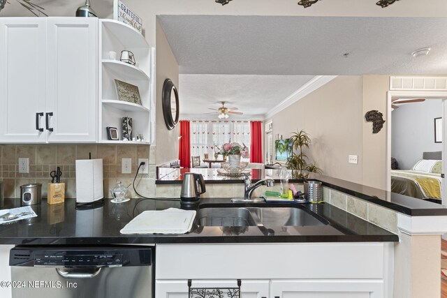 kitchen featuring kitchen peninsula, white cabinetry, ceiling fan, and stainless steel dishwasher