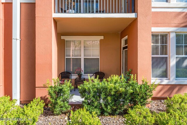 doorway to property featuring a balcony