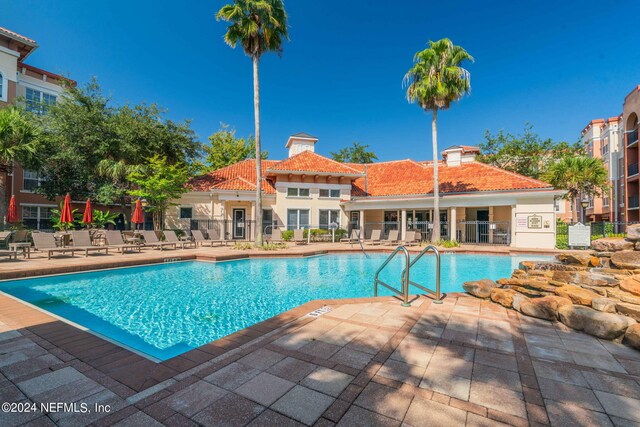 view of pool featuring a patio