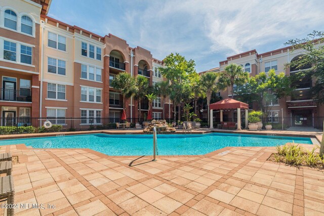 view of pool with a patio area and a gazebo