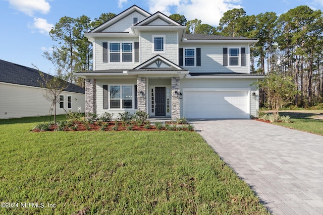 craftsman-style home with a garage and a front lawn