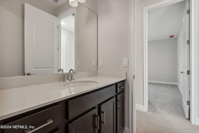 bathroom with ceiling fan and vanity