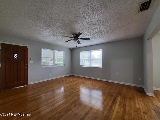 entryway featuring ceiling fan, a textured ceiling, and hardwood / wood-style floors