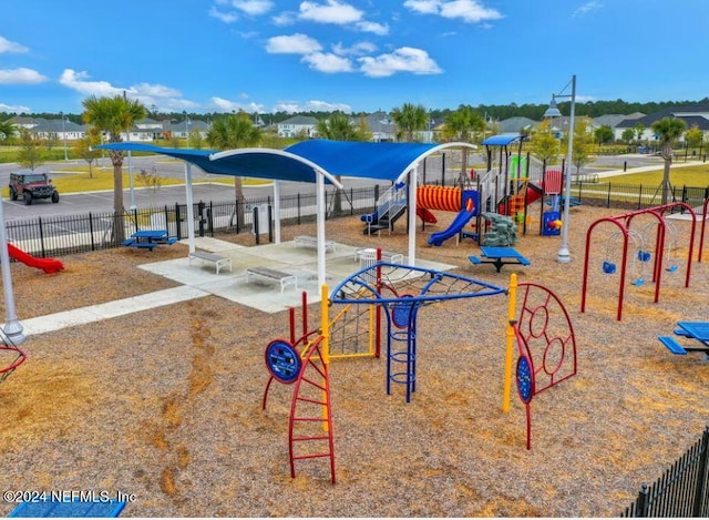 community jungle gym featuring fence