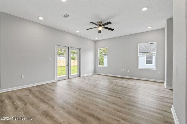 unfurnished room featuring ceiling fan and light hardwood / wood-style flooring