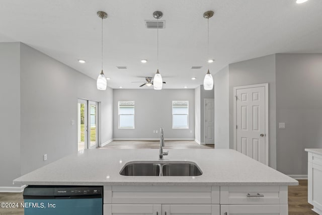 kitchen featuring white cabinets, dishwasher, hardwood / wood-style flooring, sink, and ceiling fan