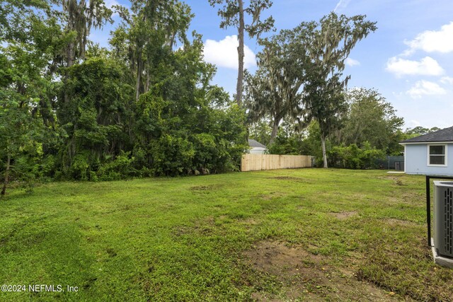 view of yard featuring central AC unit