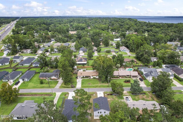 birds eye view of property featuring a water view