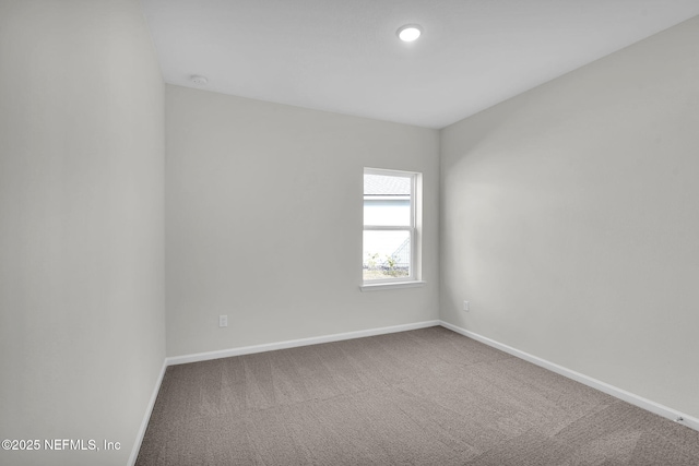 unfurnished room with carpet floors