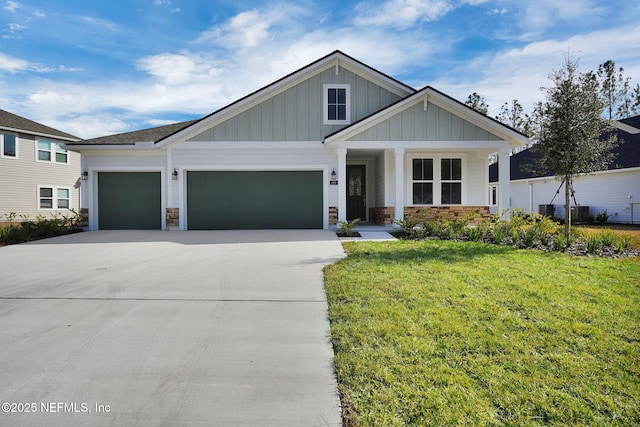 craftsman-style home with a garage and a front yard