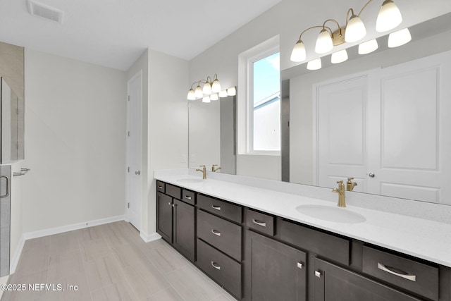 bathroom featuring walk in shower and vanity