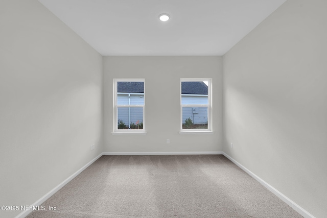 unfurnished room featuring carpet floors